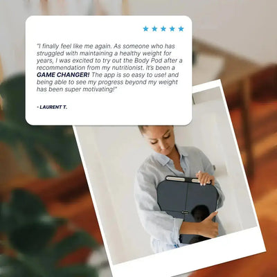 A polaroid-style customer testimonial image showing a five-star review from a customer named Laurent T., describing the Body Pod as a "game changer" for tracking health progress beyond just weight after a nutritionist recommendation. The photo below shows a woman holding the folded Body Pod scale in her arms indoors.